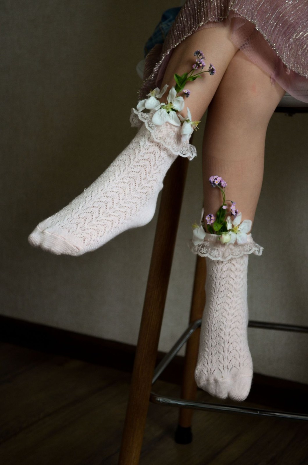Plus size ruffle socks with delicate lace trim and flowers styled on a stool