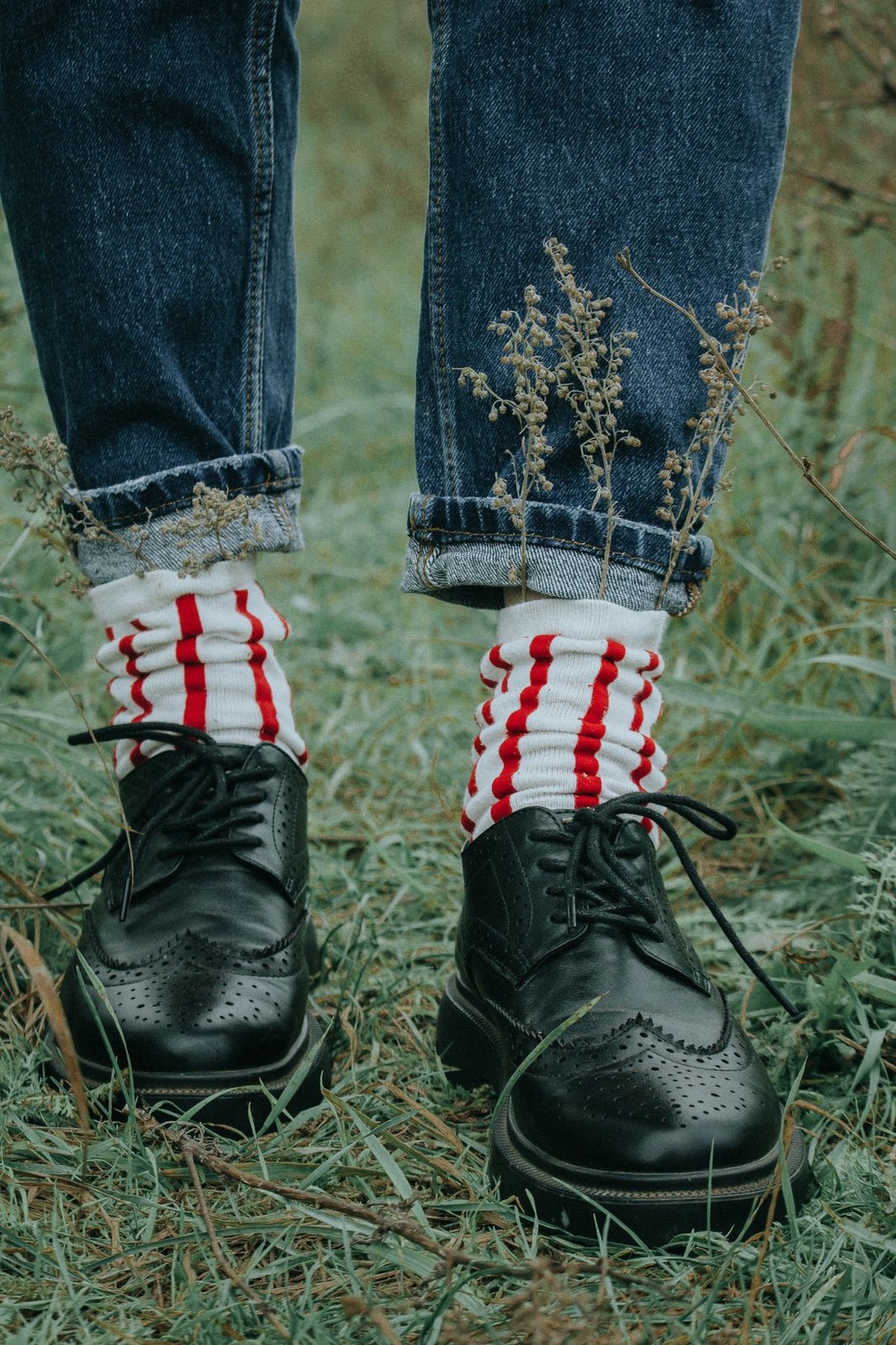 Retro red and white striped socks styled with black brogues in a striped sock packs look